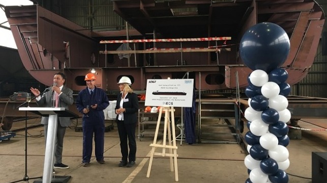 Hugh Carmichael (INEOS/middle), with Anke Bestmann (Imperial Logistics) and Peter Versluis (VEKA) addresses guests at the keel laying, in front of the vessel’s first hull section. Photo:VEKA