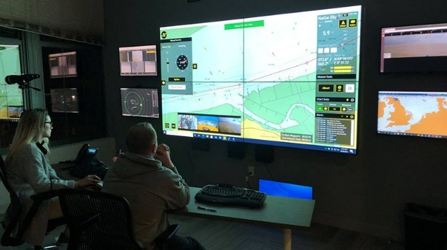 AMO deck officers Bridget Quinn and Adam Szloch remotely command the NELLIE BLY in Denmark from Sea Machines' Boston control room. / Image source: American Maritime Officers