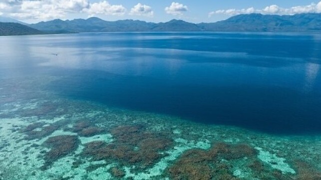 Coral reefs encircled by hills