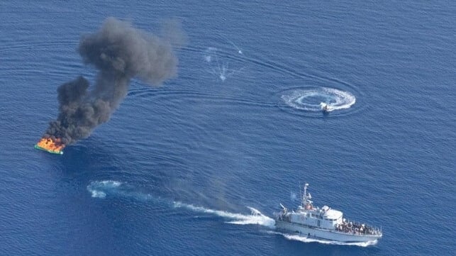 Libyan Coast Guard burns a boat