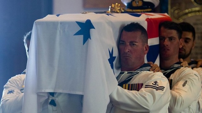 Pallbearers from HMAS Melbourne (III) carry the late Captain John Stevenson, AM, RAN (Retd) into the Naval Chapel at HMAS Kuttabul for his funeral.