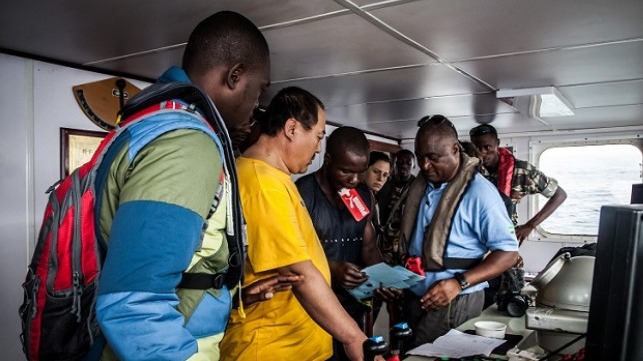 Gabonese authorities inspect the bridge of the Haixin 27.