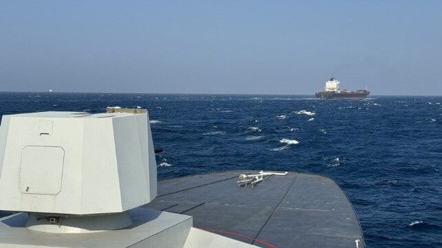 naval ship escorting containership