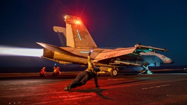Crew of the USS Dwight D. Eisenhower launch an FA-18 fighter, Feb. 24 (USN)