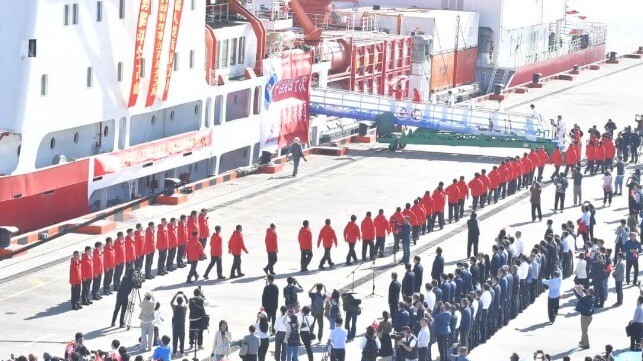 Members of China's 40th Antarctic expedition board the Xue Long 2 for the voyage south (PRIC)