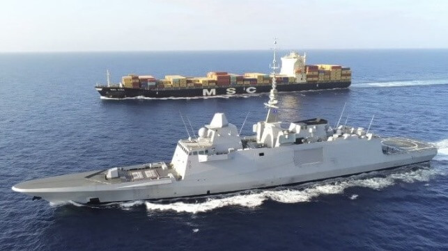 warship escorting MSC containership