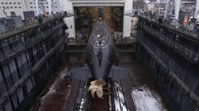 Diesel electric submarine rolled out onto a floating drydock