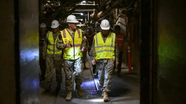 Vice Adm. John Wade, Commander, Joint Task Force-Red Hill (JTF-RH), escorts Vice Adm. Scott Gray, Commander, Navy Installations Command, during a visit to the Red Hill Bulk Fuel Storage Facility (RHBFSF),