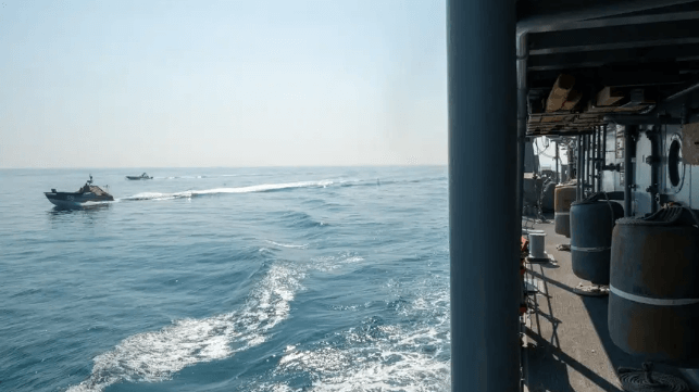 Drone boats operating alongside a Navy minesweeper in the Arabian Gulf last year (USN)