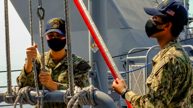 Sailors raise the commissioning pennant aboard USS Tripoli, July 15 (USN)
