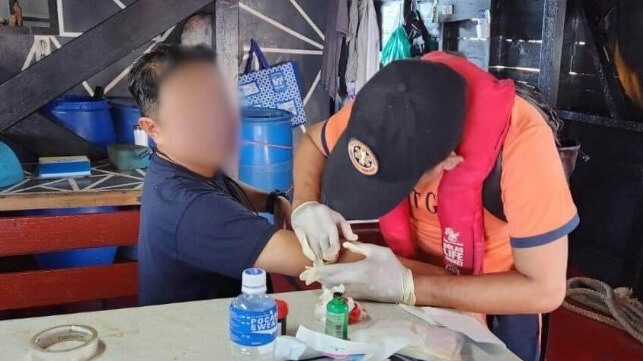 A crewmember aboard Unaizah May 4 receives medical attention after the water-cannon incident (Armed Forces of the Philippines)