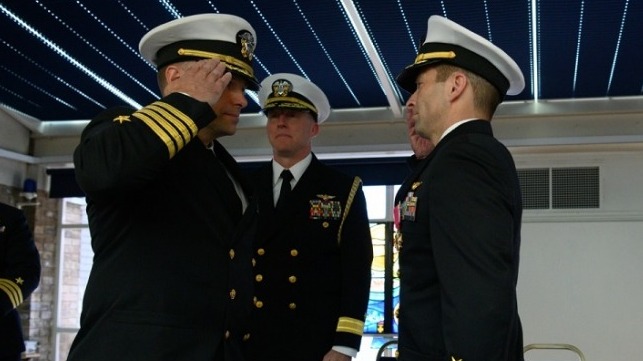 Capt. Kevin M. Quarderer, right, is relieved by Capt. James P. Borghardt during a change of command ceremony for the Office of Naval Research Global. Rear Adm. David G. Manero, center, U.S. senior defense official/defense attaché, United Kingdom, presides.