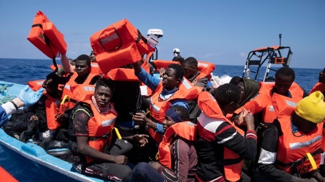 Migrants with life jackets