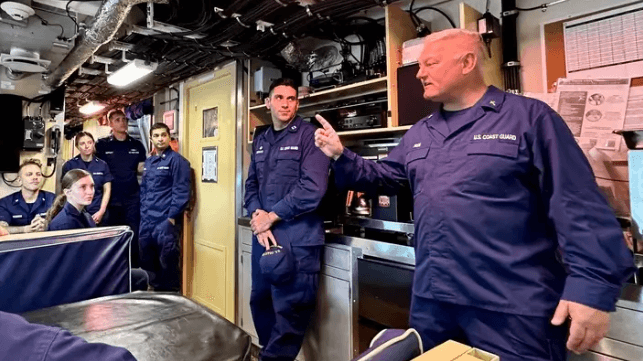 Capt. Mode (right) visits the cutter USCGC Oliver Henry in Guam, Dec. 2023 (USCG)