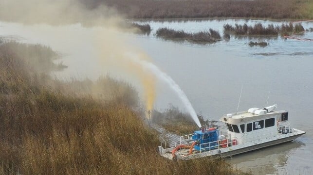 A leaking well sprays an oil and gas mixture into the air near Pass a Loutre, Louisiana (USCG)