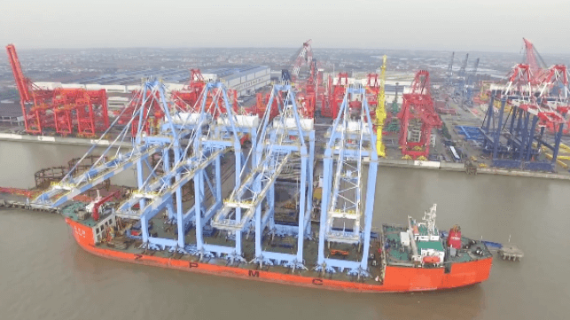 Brand new cranes leave the ZPMC yard aboard a heavy-lift ship (ZPMC file image)