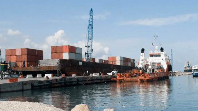 A deck barge with an embarked crane delivered containerized aid to Haiti during the 2010 earthquake response (USN file image)