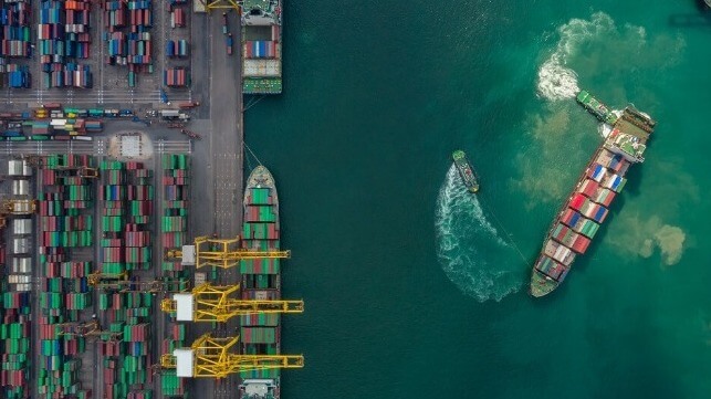 iStock image of container ship maneuvering in port