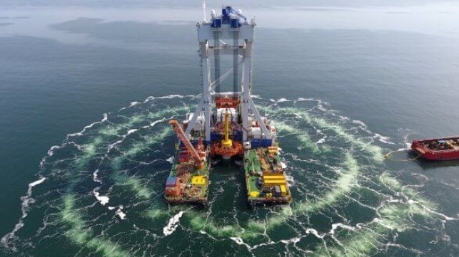 Twin curtains of bubbles surround a pile-driver during turbine foundation installation (Vineyard Wind)