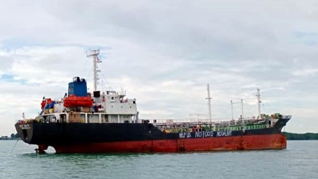 Abandoned in Malaysia a Vietnamese crew painted distress messages on their vessel