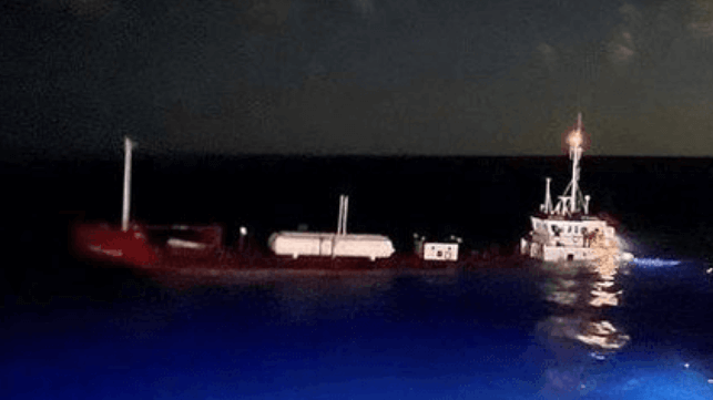 Tanker Tropic Breeze settles in the water after she was struck by Utopia IV (NTSB)