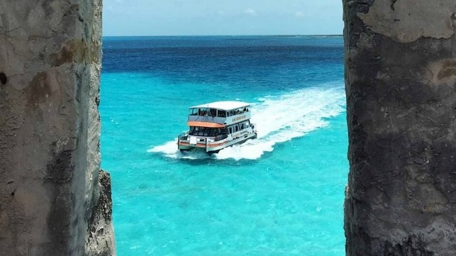 Excursion boat under way in blue-green water