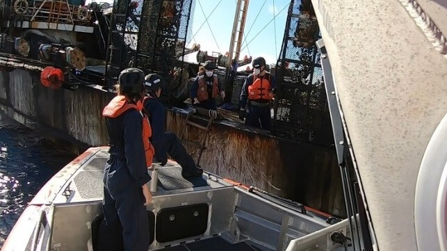 A U.S. Coast Guard inspection team goes aboard a foreign-flag squid jigger off the Galapagos, 2022 (USCG)