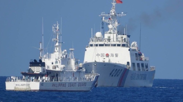 A Philippine Coast Guard vessel encounters a China Coast Guard cutter in close quarters (PCG)