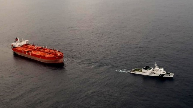 blacked out oil tanker towed by Indian Coast Guard
