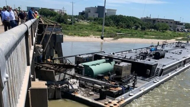 Barge stuck in bridge after allision