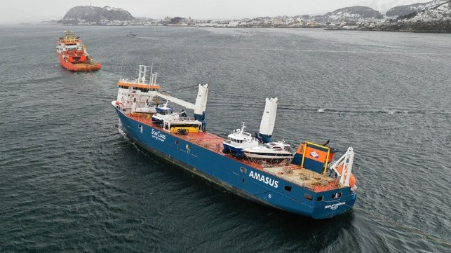 drifting heavy-lift vessel brough to port