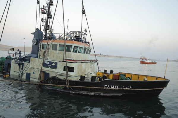 Photos: Suez Canal Recovers Tug After Collision