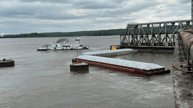 Joe B. Wyatt (background) and two barges after the allision (NTSB)
