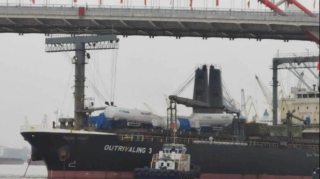 ship stuck under bridge