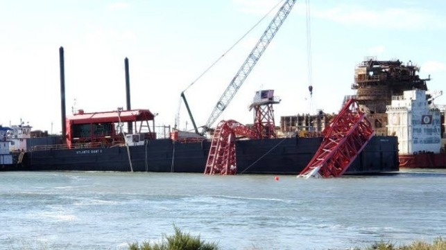 Collapsed crane boom on Atlantic Giant II. In background are TOPS DB1 and BOABARGE 29. (Photo by Coast Guard)