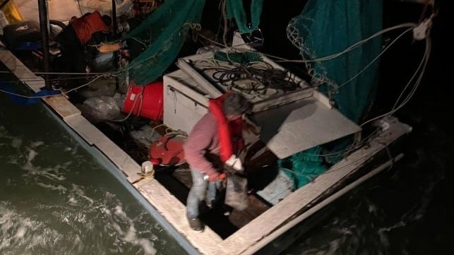 Fisherman prepares to abandon ship from stricken fishing vessel