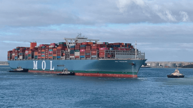 Boxship drifting with many tugs helping