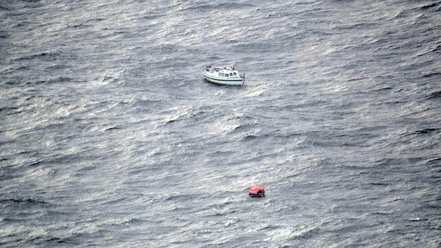 Good Samaritans Rescue American Yachtsman in North Atlantic Damaged yacht in the North Atlantic with an inflatable liferaft nearby