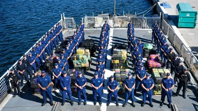 Crew of USCGC Seneca at the pier with seized cocaine cargoes, September 2025 (USCG file image)
